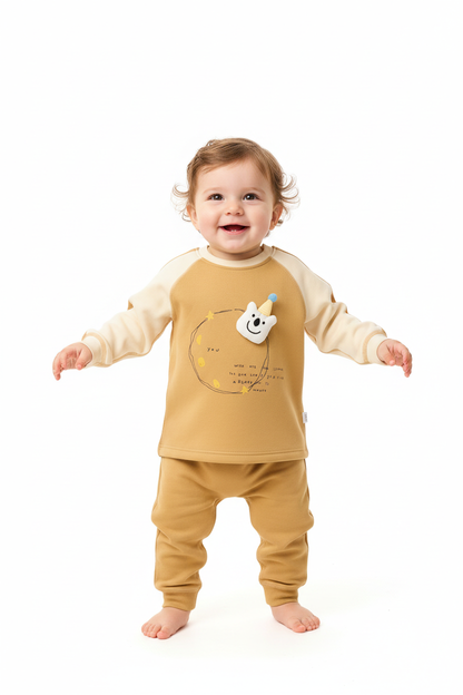 Child standing in mustard yellow romper - front view